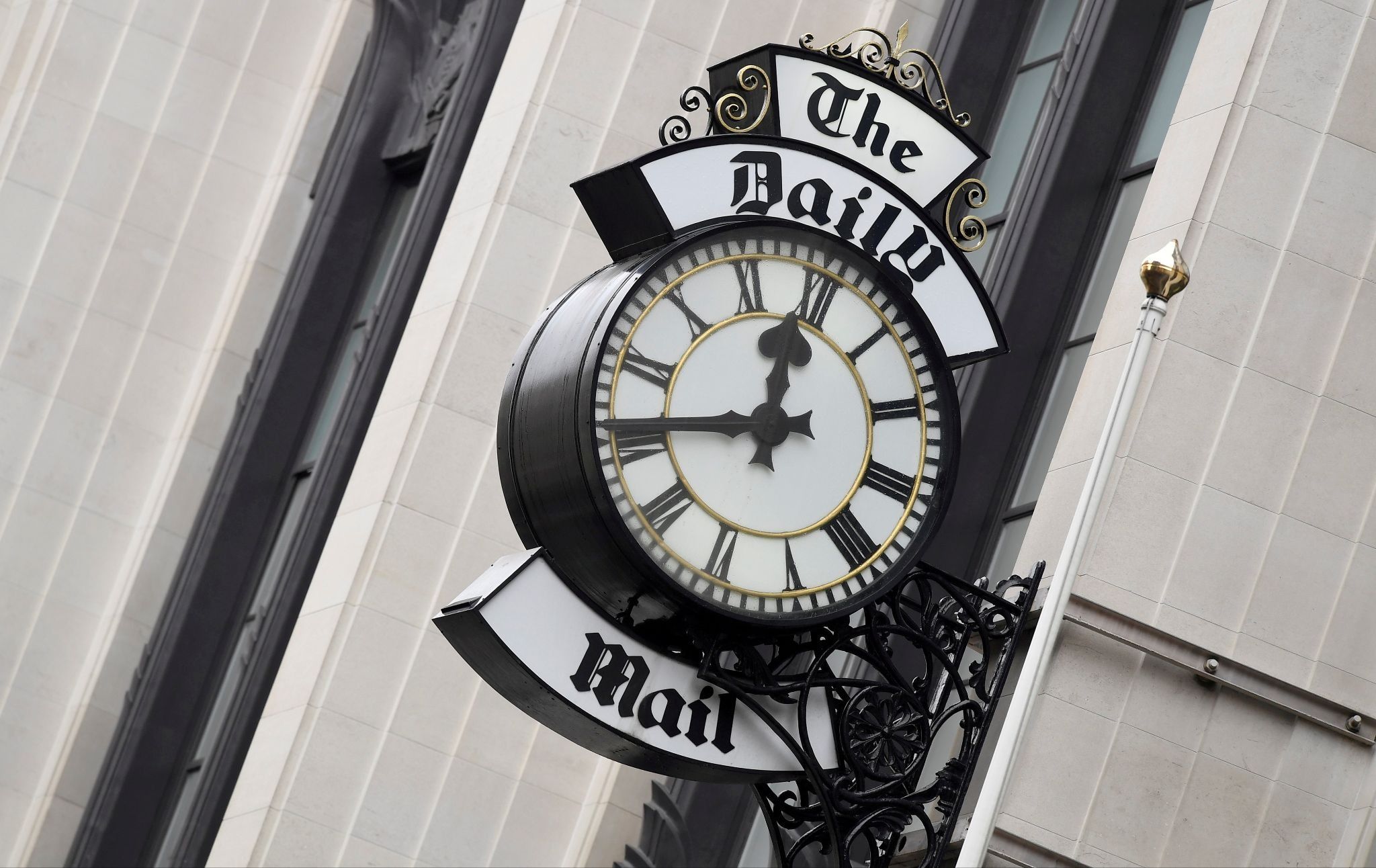 A clock face is seen outside of the London offices of the Daily Mail newspaper in London, Britain. 