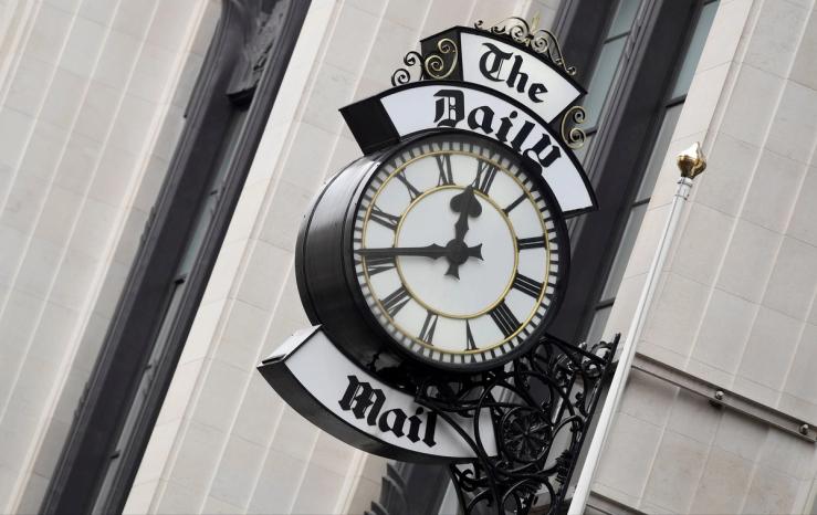 A clock face is seen outside of the London offices of the Daily Mail newspaper in London, Britain.