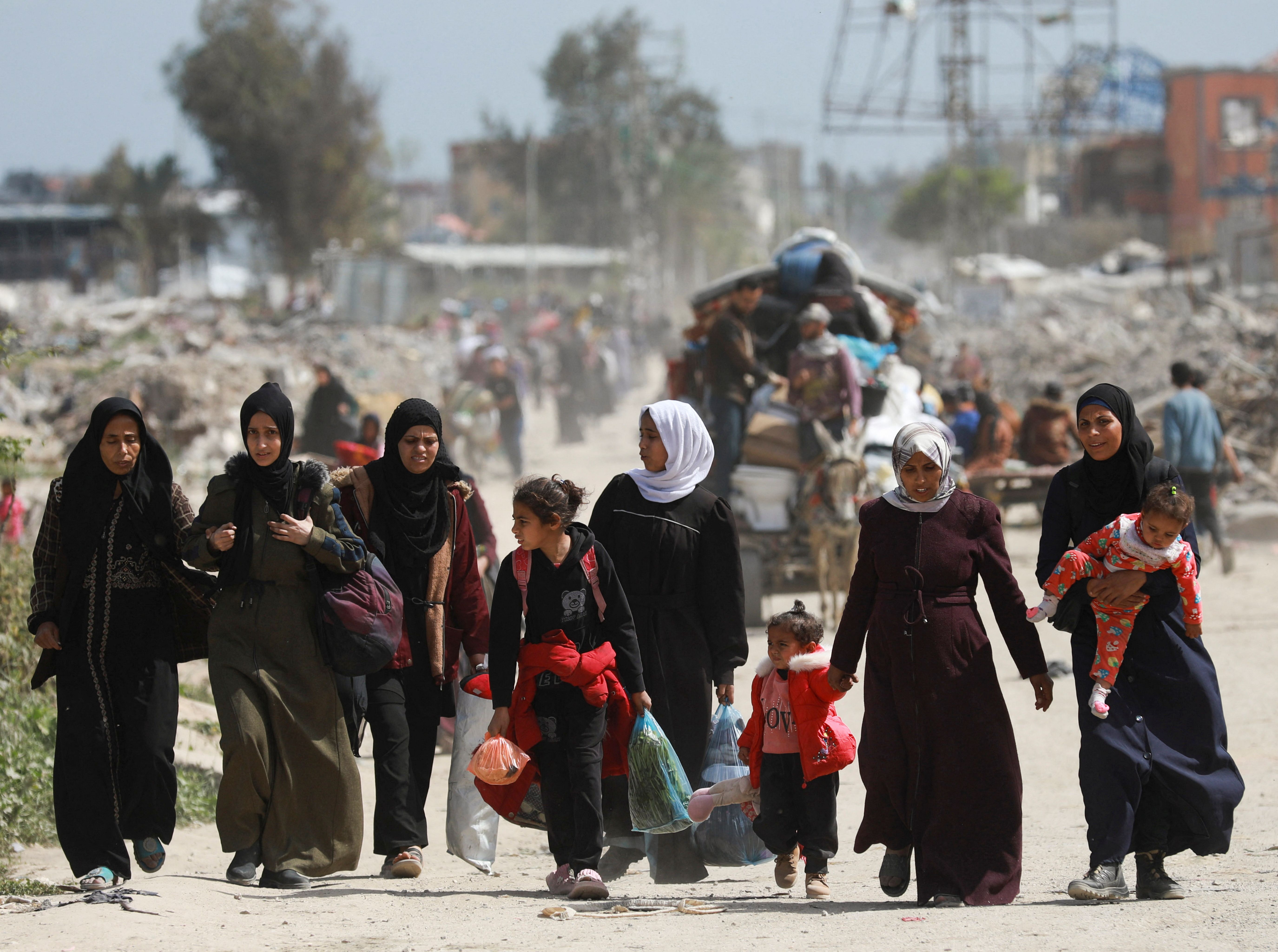 Palestinians in Gaza make their way to flee their homes.