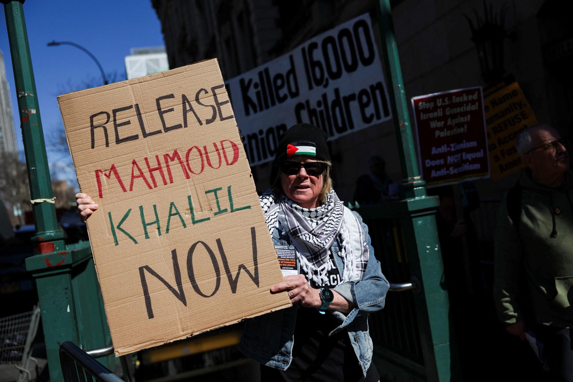 A person holds a sign during a protest following the arrest by U.S. immigration agents of Palestinian student protester Mahmoud Khalil at Columbia University.