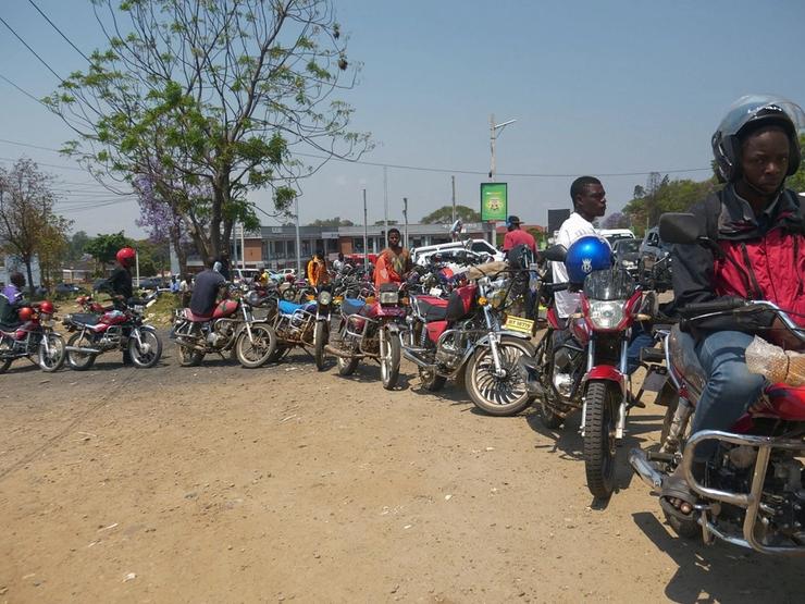 Motorbike riders line up to buy fuel in Blantyre, Malawi.