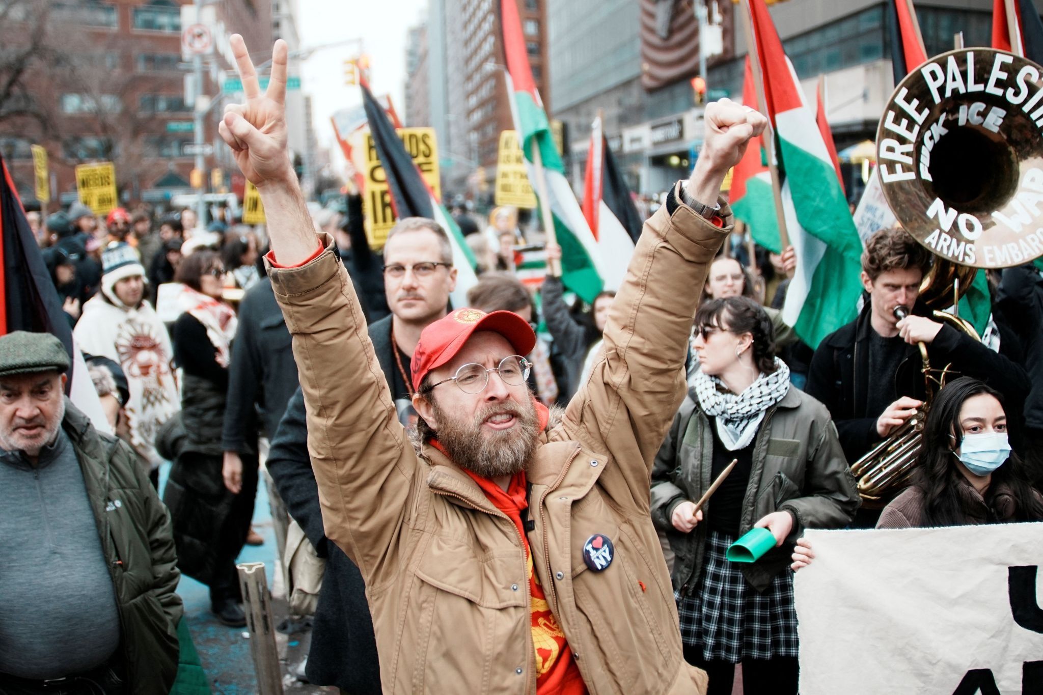 Protesters march with Palestinian flags