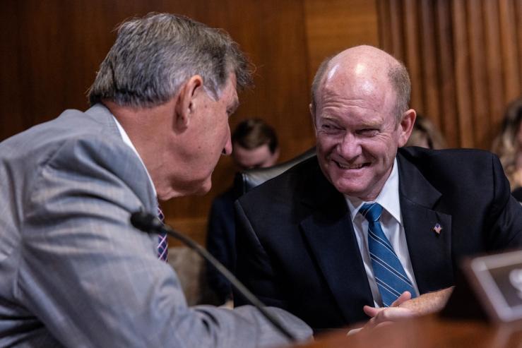 Sen. Chris Coons, D-Del., at right, with former Sen. Joe Manchin, D-W.Va.