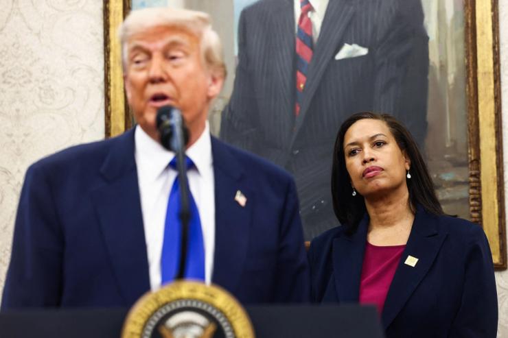DC Mayor Muriel Bowser watches as President Trump announces DC will host the 2027 NFL draft.