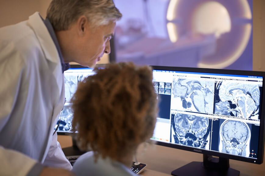 Radiologists analyze an MRI scan.