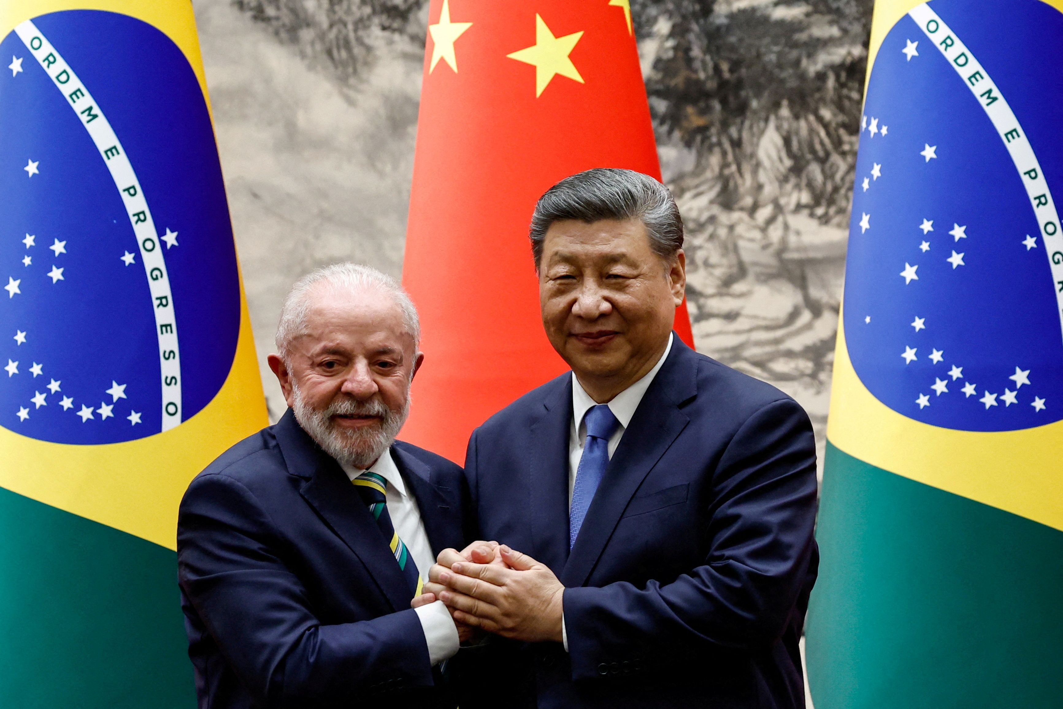 Chinese President Xi Jinping shakes hands with Brazil’s President Luiz Inacio Lula da Silva