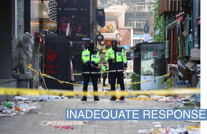 Policemen stand guard at the scene where a stampede during Halloween festivities killed and injured many people at the popular Itaewon district in Seoul, South Korea, October 30, 2022.