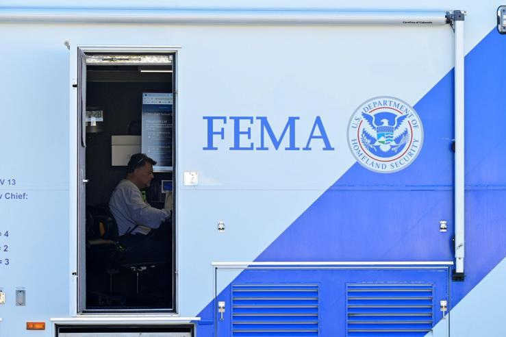 A man working at a FEMA command center