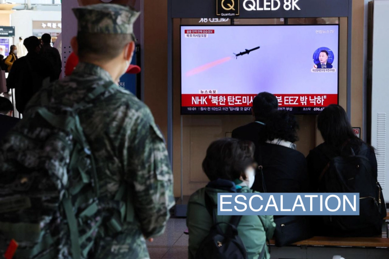 People watch a TV broadcasting a news report on North Korea firing three ballistic missiles into the sea, in Seoul, South Korea, November 2, 2022.