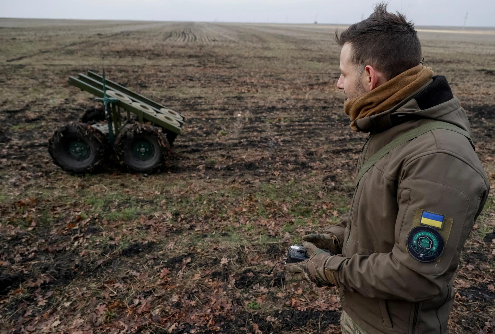 A Ukrainian serviceman operating a mine-laying unmanned ground vehicle in Kharkiv region.