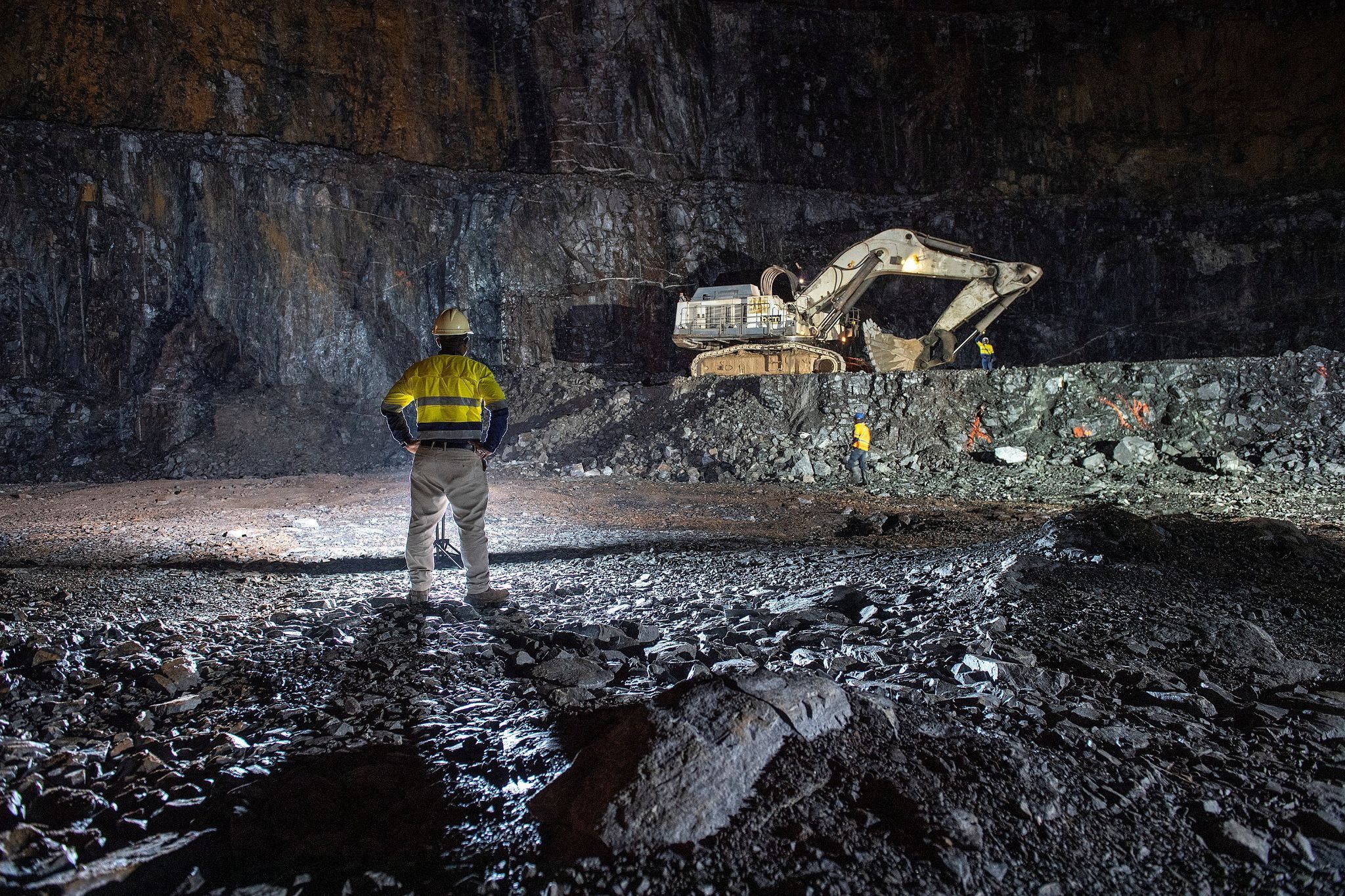 Employees work at Damang gold mine near the town of Abosso, Ghana.