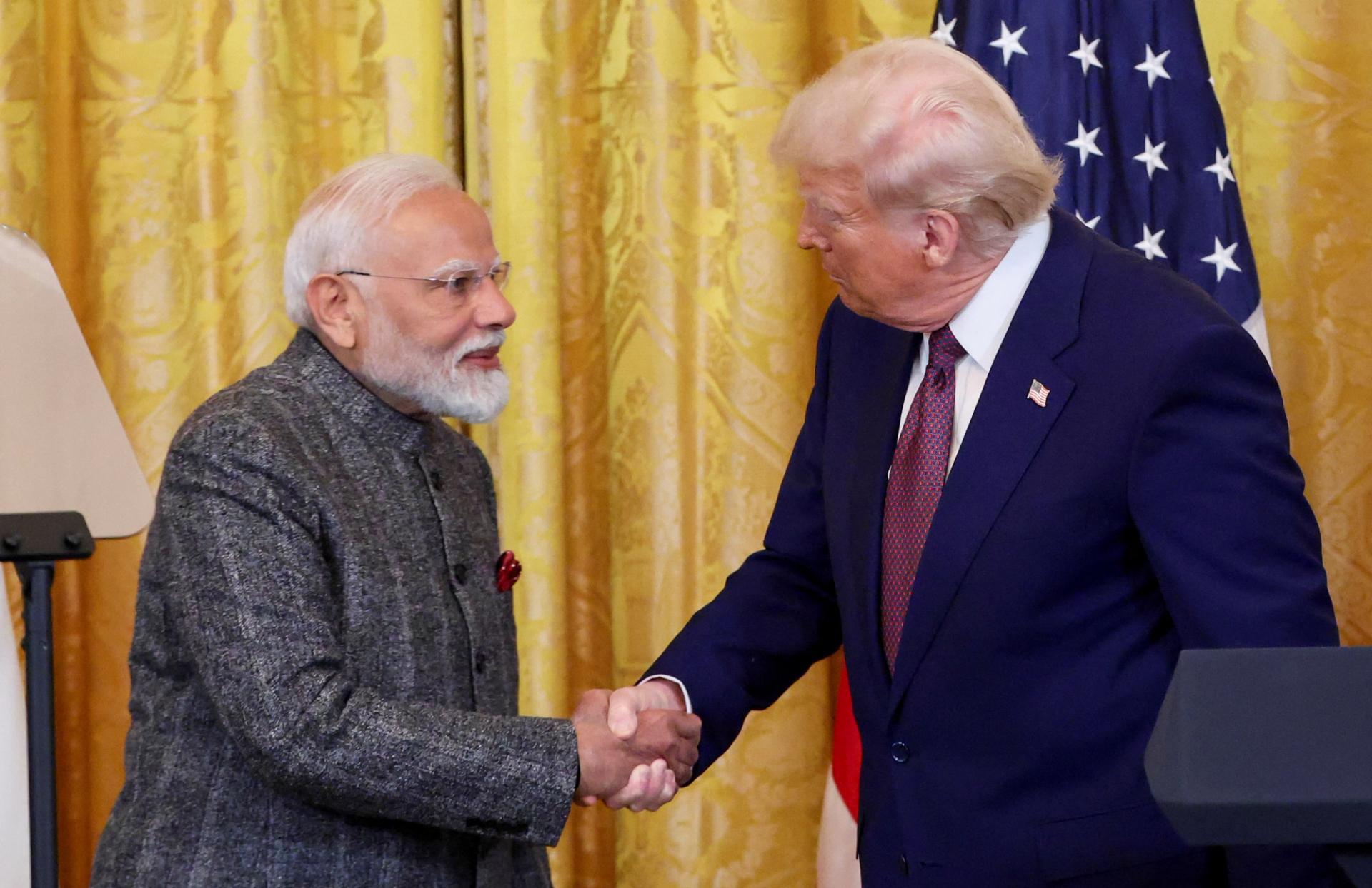 U.S. President Donald Trump and Indian Prime Minister Narendra Modi shake hands as they attend a joint press conference at the White House in Washington, D.C., U.S., February 13, 2025.