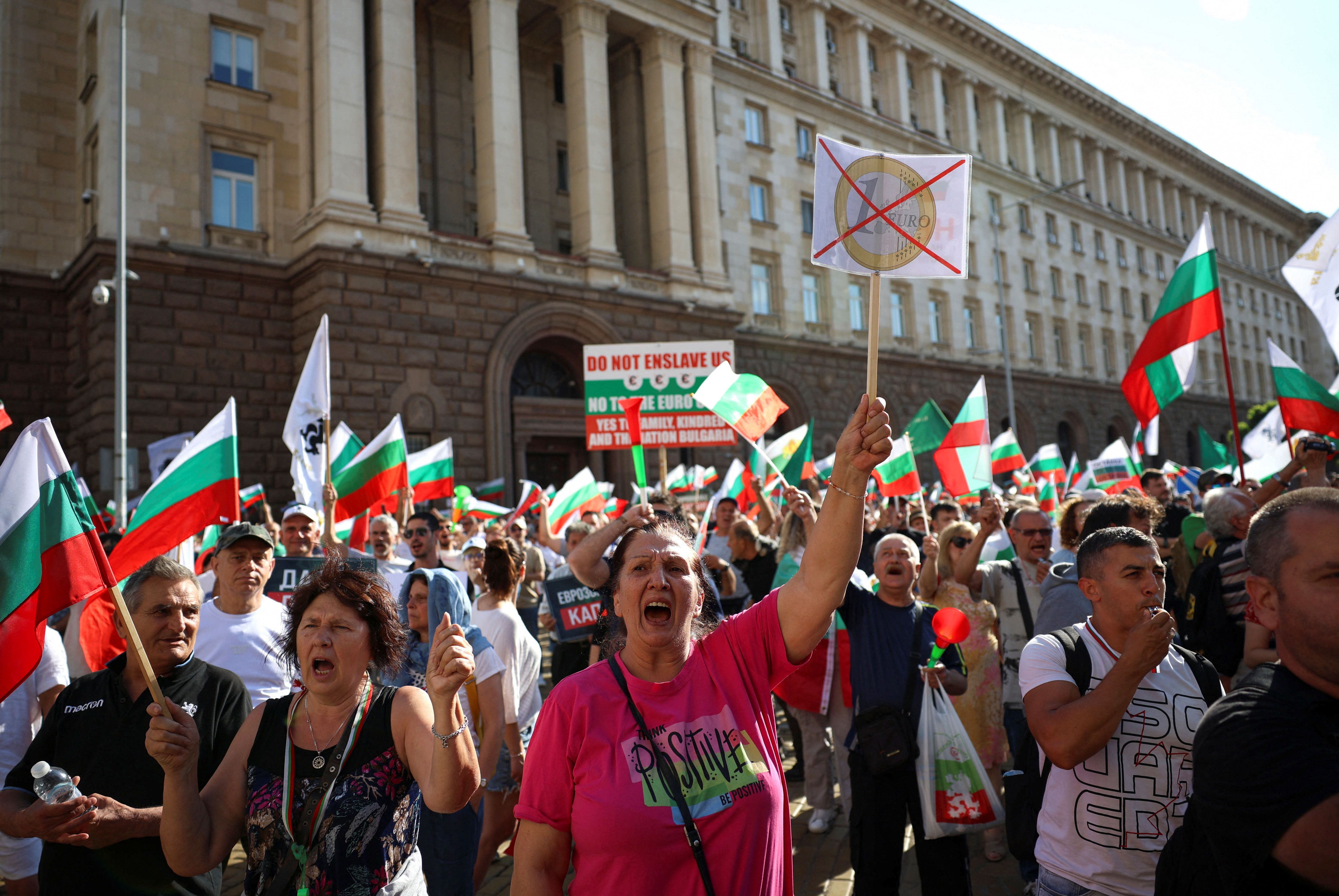 Protesters hold banners and flags as they participate in a demonstration, organised by Bulgaria’s ultranationalist Revival party.