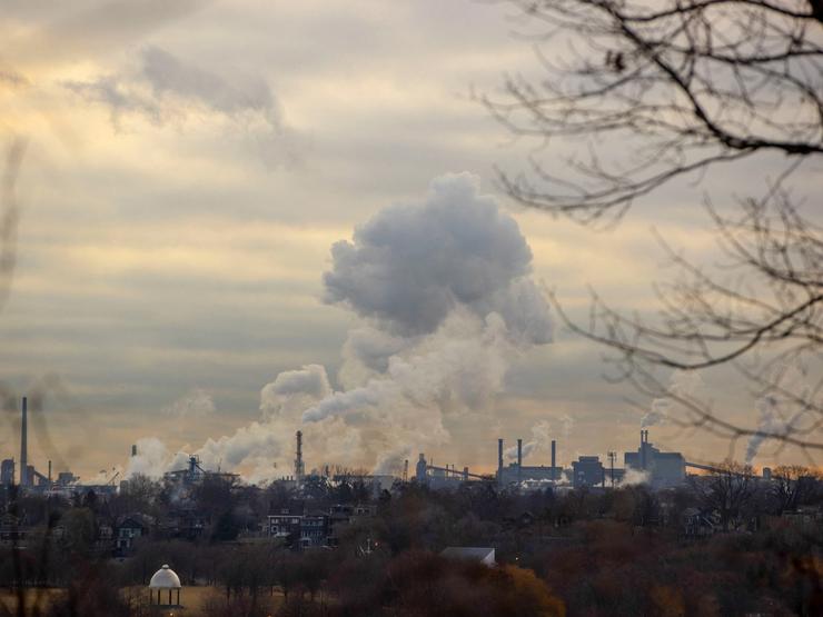 Emissions billows from an industrial sector housing steel companies in Canada.