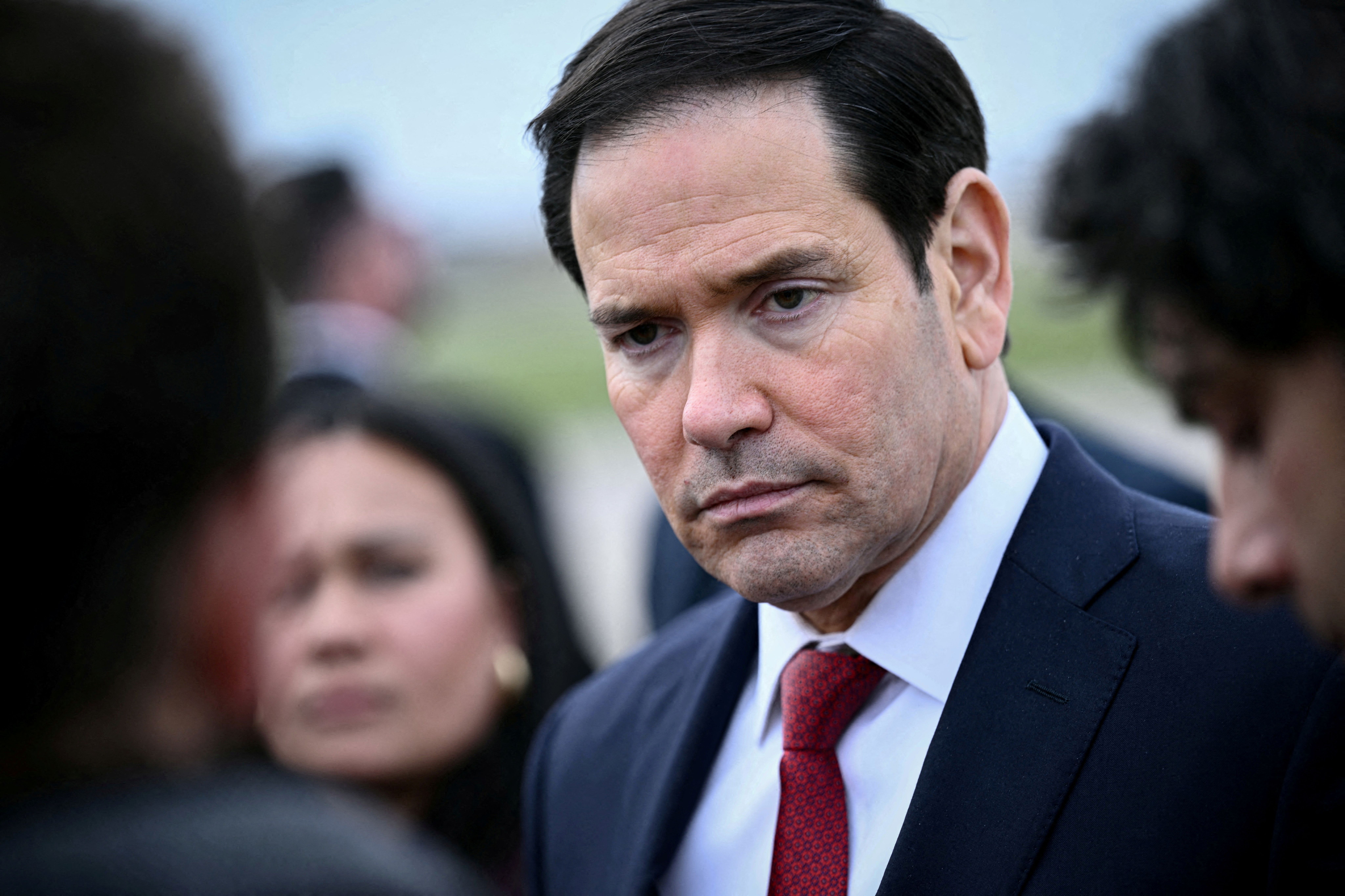 US Secretary of State Marco Rubio looks on as he speaks to the press before his departure following a G7 Foreign Ministers’ meeting with Partner Countries before his departure at the Bourget airport in Le Bourget, outside Paris, France