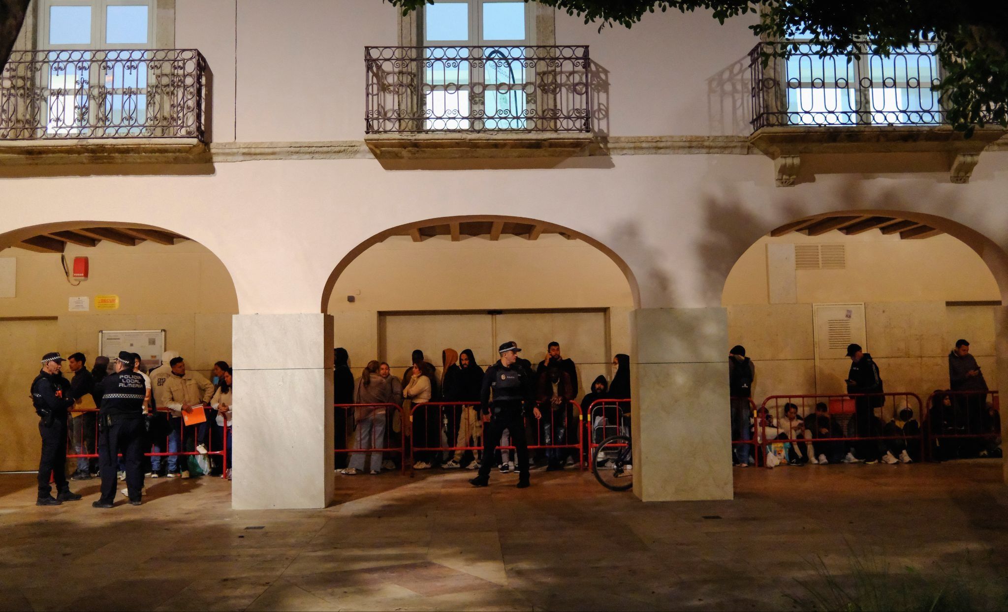 Migrants queue in Spain