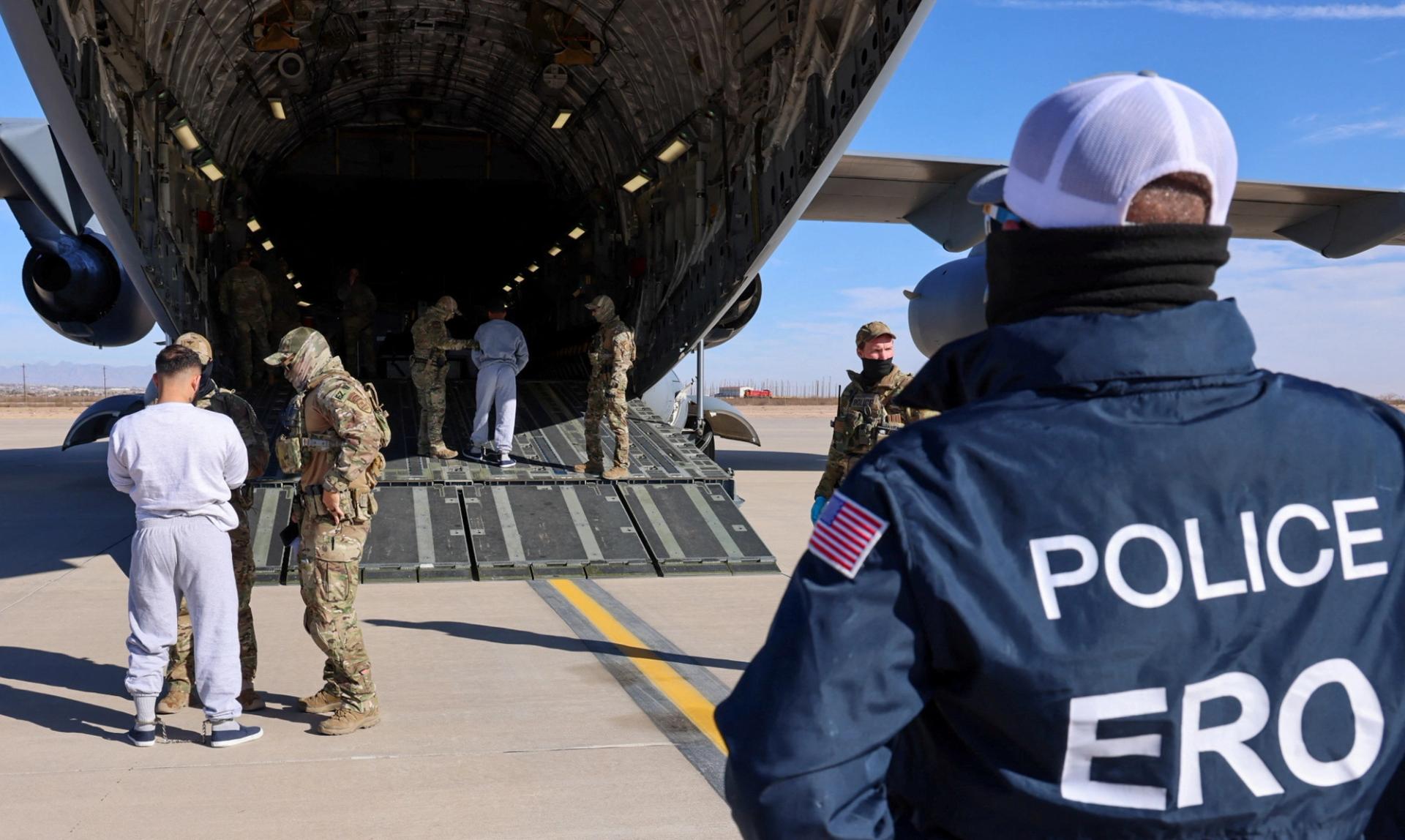 A DHS handout photo shows migrants being loaded.