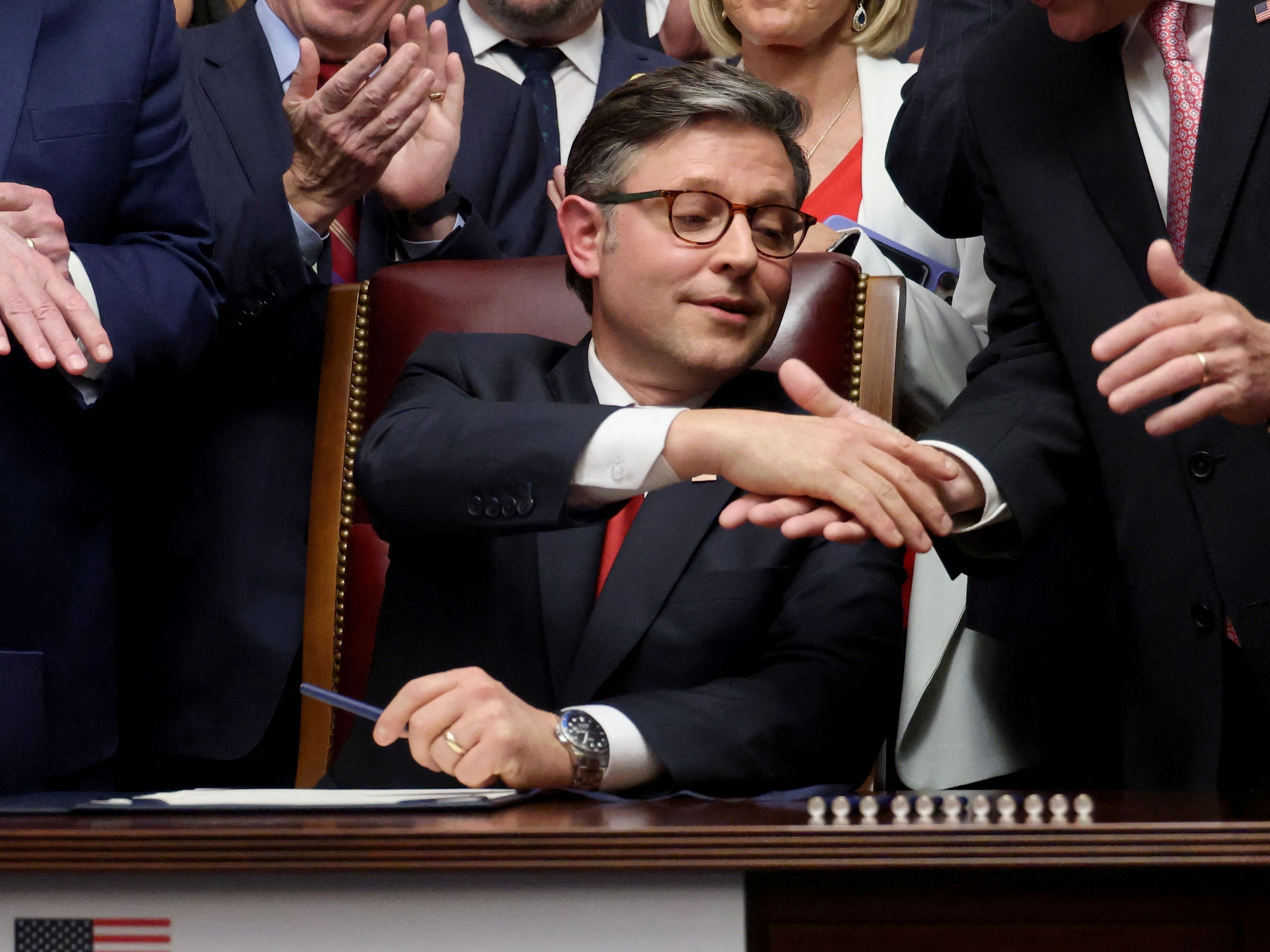 Mike Johnson shakes hands