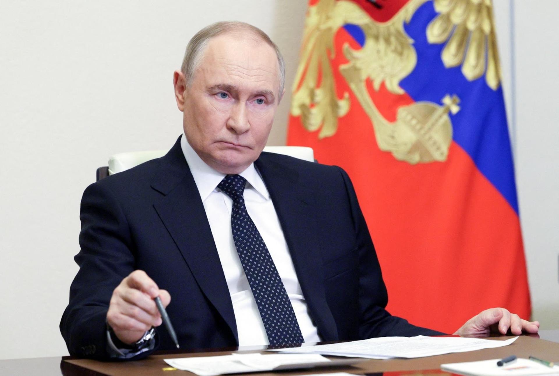 Russia’s President Vladimir Putin chairs a meeting of Kremlin advisors.