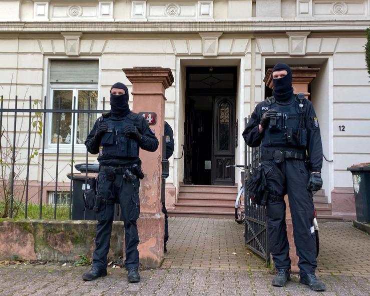 Police secures the area after 25 suspected members and supporters of a far-right terrorist group were detained during raids across Germany, in Frankfurt, Germany