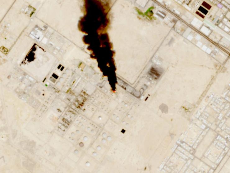 Smoke rises from the site of the Saudi Aramco refinery after reported Houthi attacks.