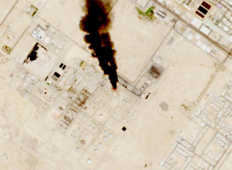 Smoke rises from the site of the Saudi Aramco refinery after reported Houthi attacks.
