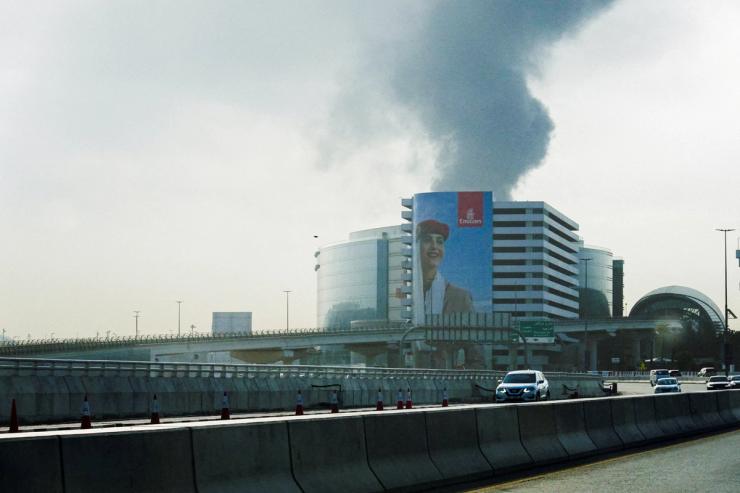 Smoke rises from the Dubai International Airport.