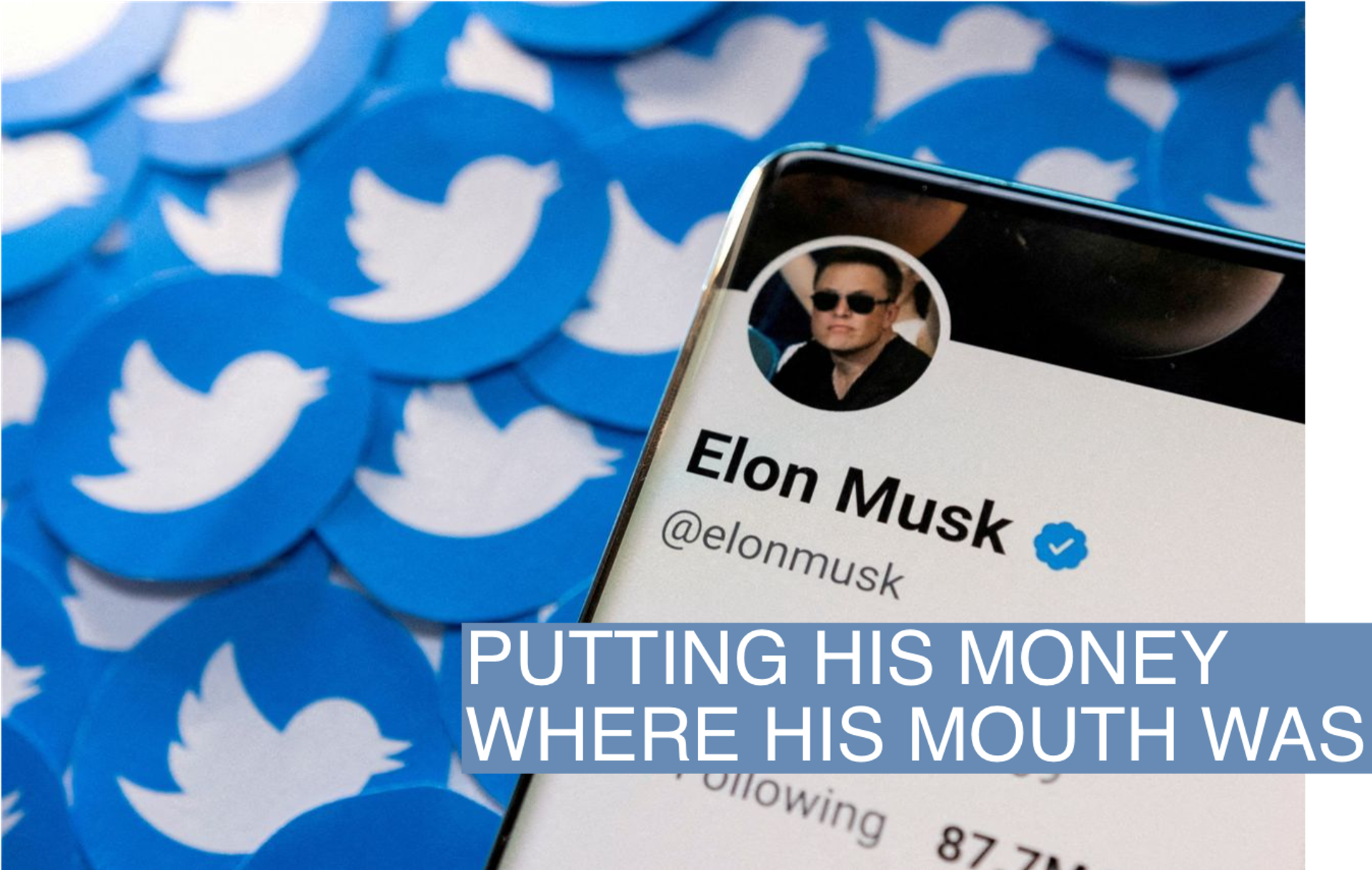 Elon Musk's Twitter profile is seen on a smartphone placed on printed Twitter logos in this picture illustration taken April 28, 2022.