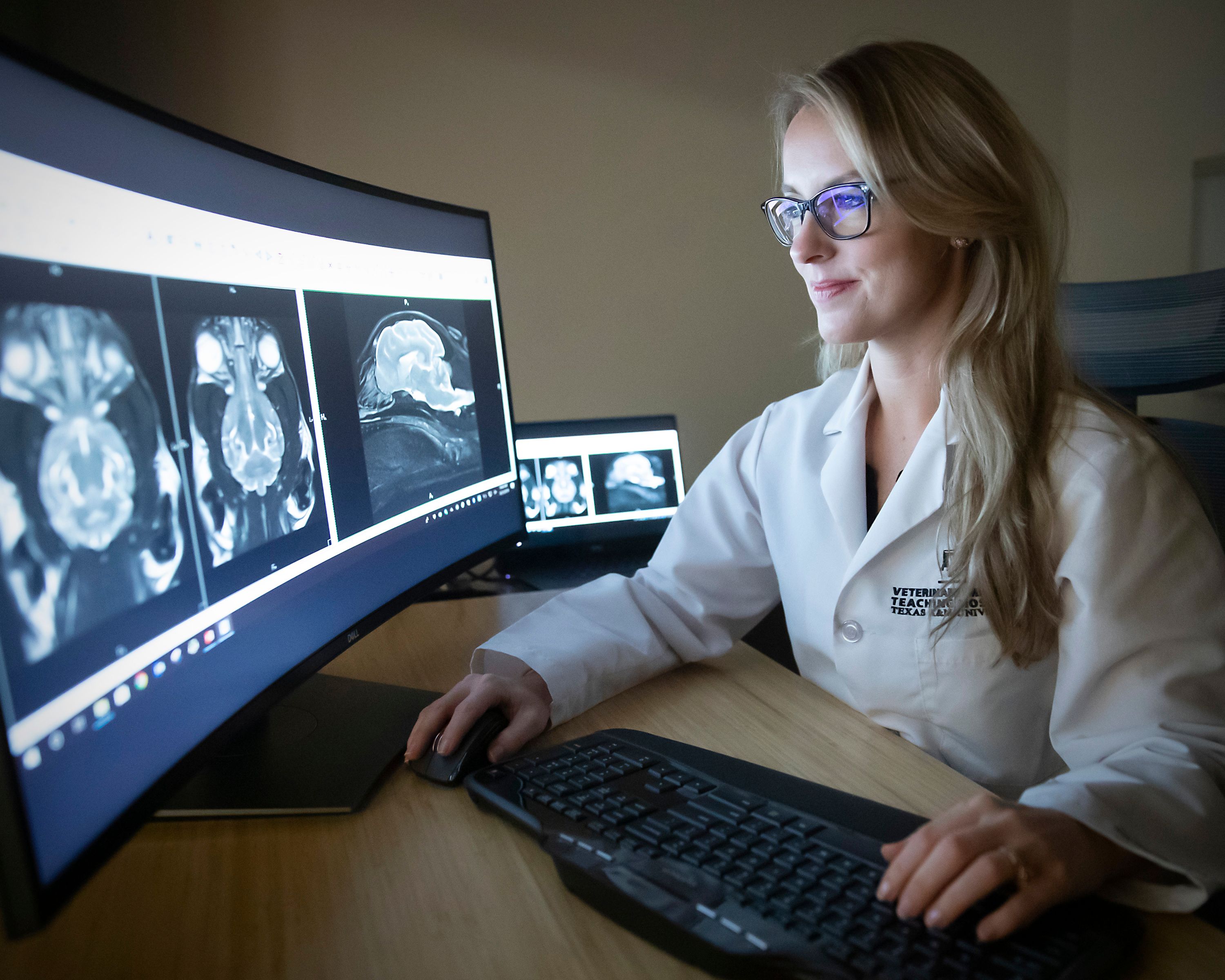 A woman looking at scans