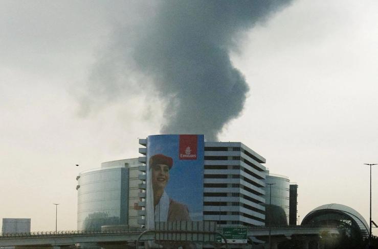 Smoke rises from Dubai International Airport.