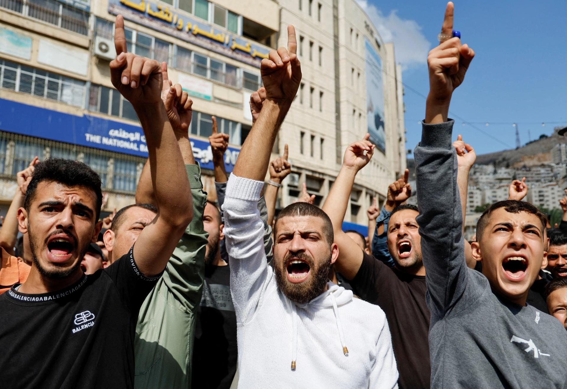 Palestinians take part in a protest in support of the people in Gaza