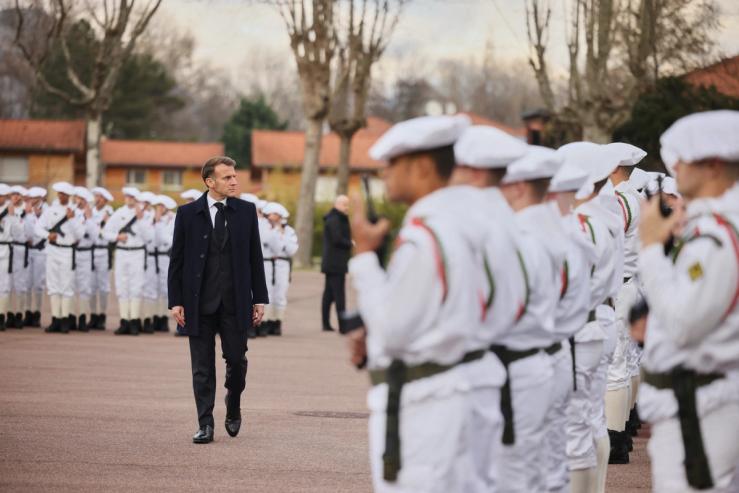 French President Emmanuel Macron surveys French troops