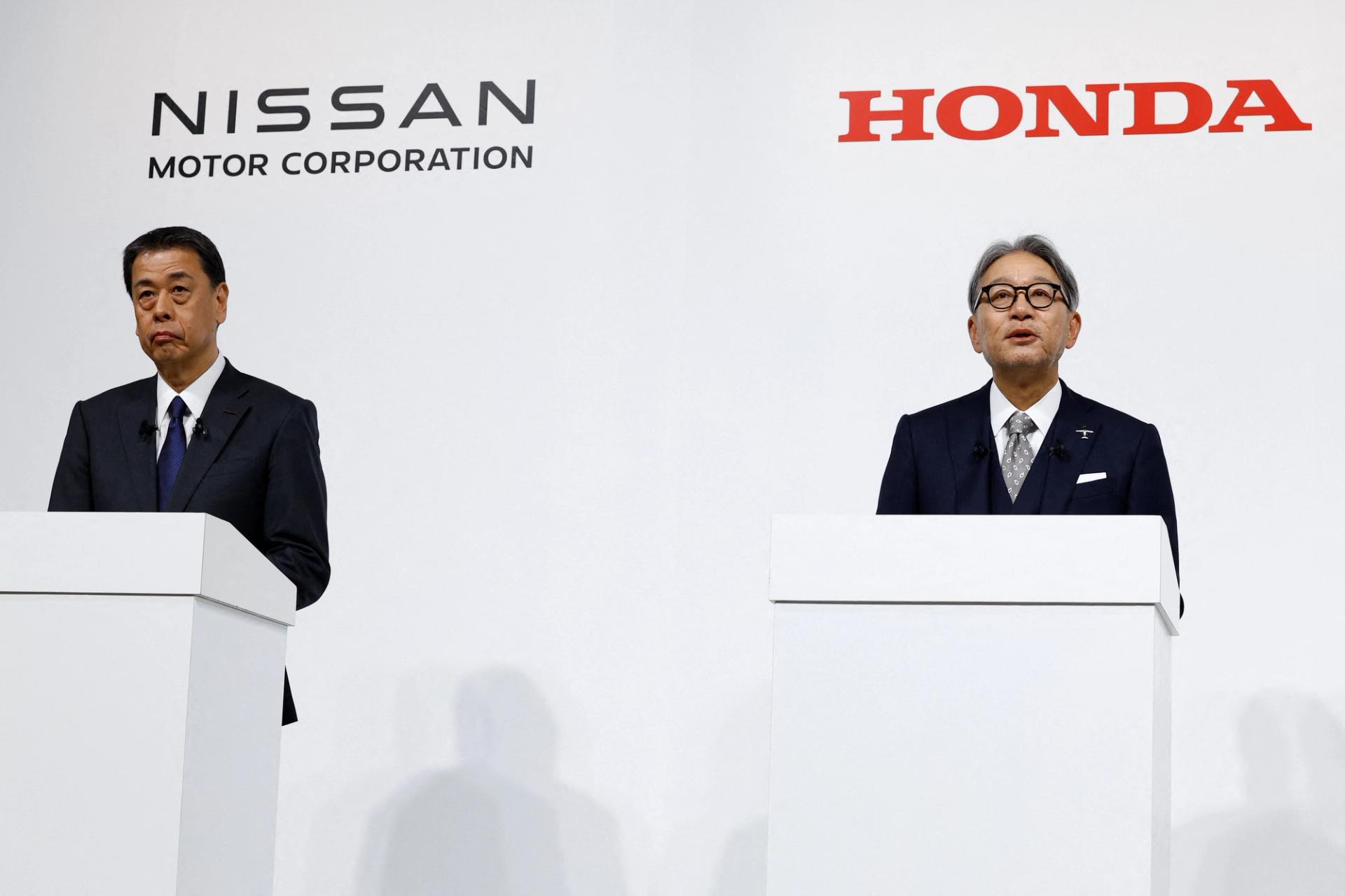 Makoto Uchida, Director, Representative Executive Officer, President and CEO of Nissan Motor Corporation and Toshihiro Mibe, Director, President and Representative Executive Officer of Honda, hold a joint press conference on their merger talks, in Tokyo, Japan.