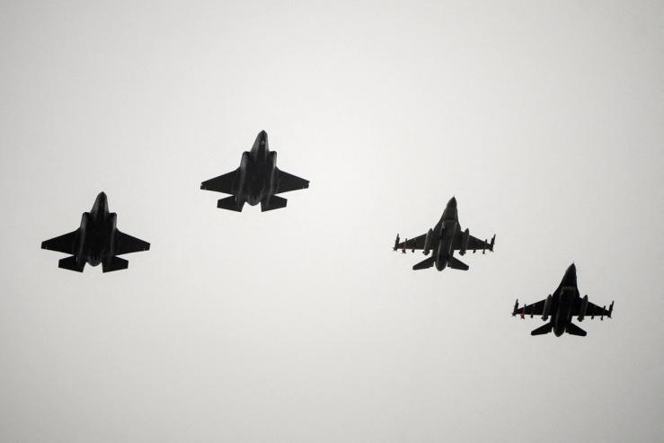 Two F-16 and two F-35 fighter jets return to air base Flyvestation Skrydstrup after patrolling around Denmark.