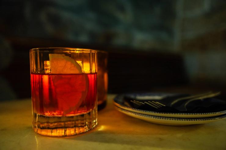A cocktail of equal parts Gin, Vermouth and Campari