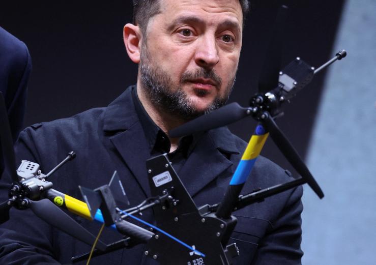 Zelenskyy looking at a drone.