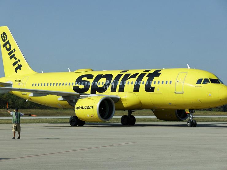 A Spirit Airlines flight arrives at Arnold Palmer Regional Airport