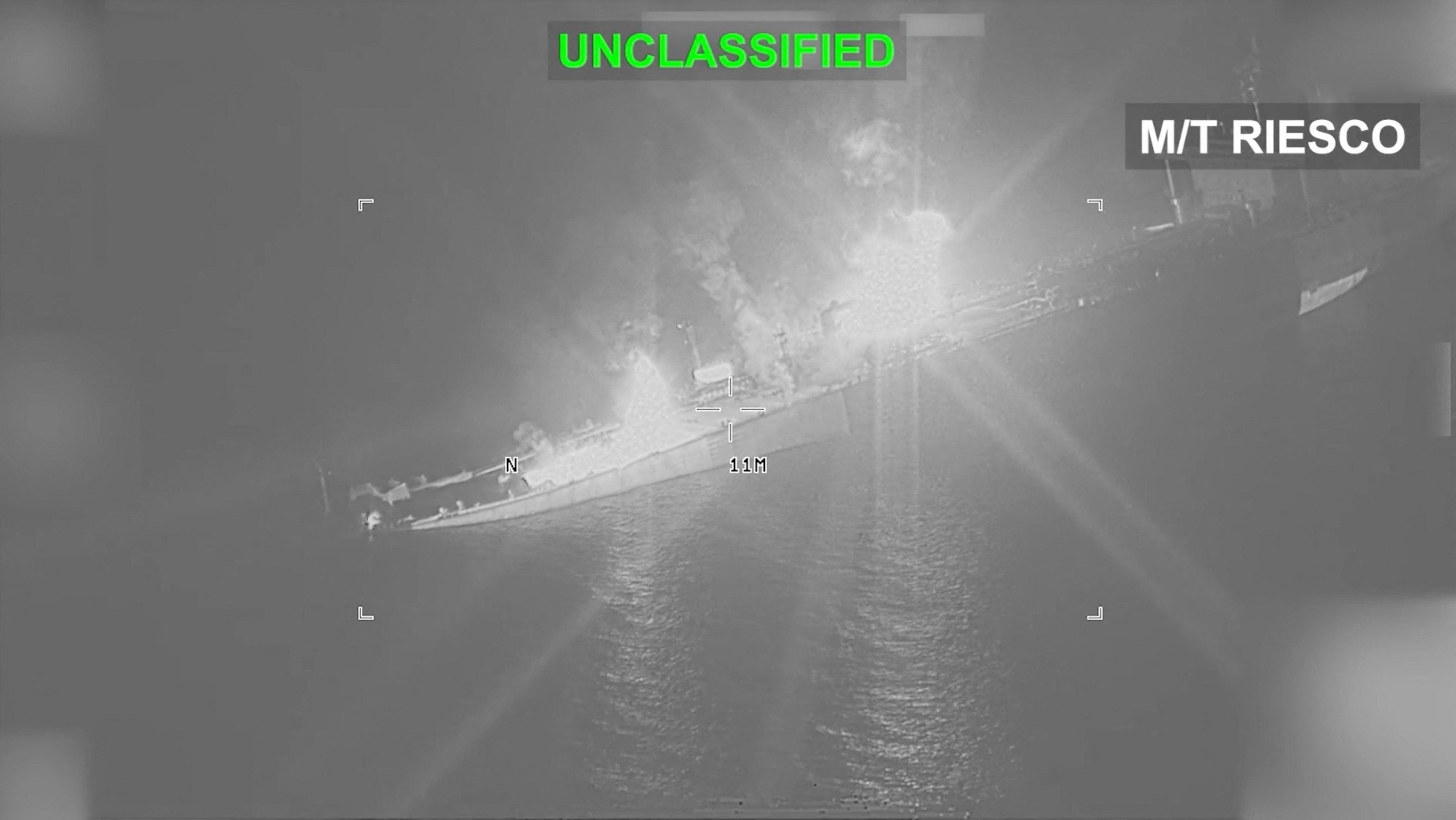 An Iranian crude oil carrier identified as M/T Riesco burns as it sinks.