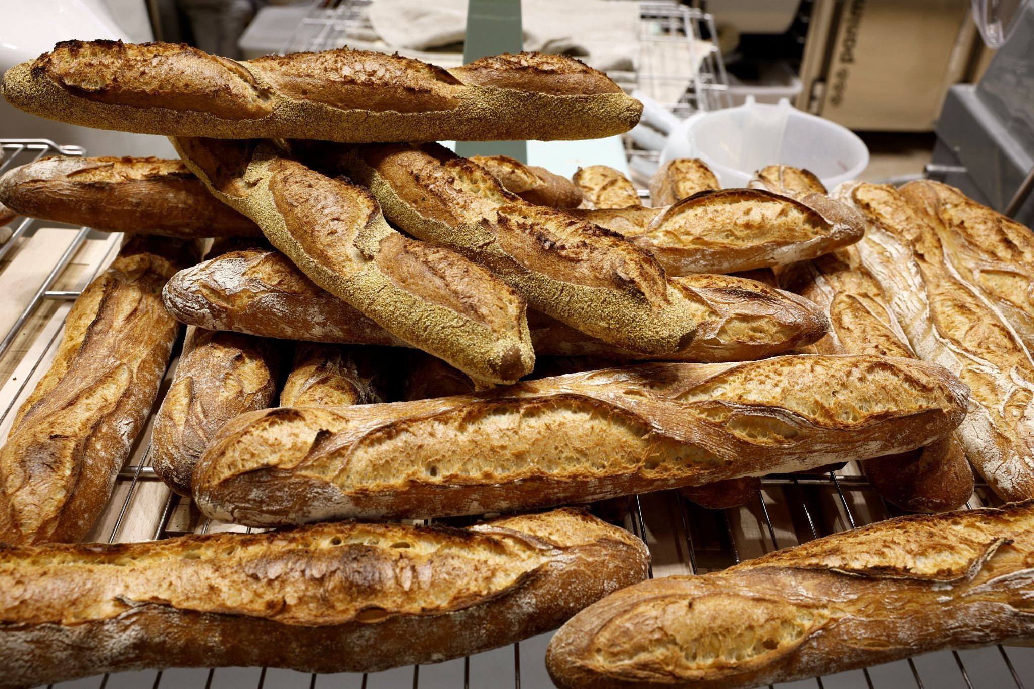 A pile of baguettes in a Paris bakery