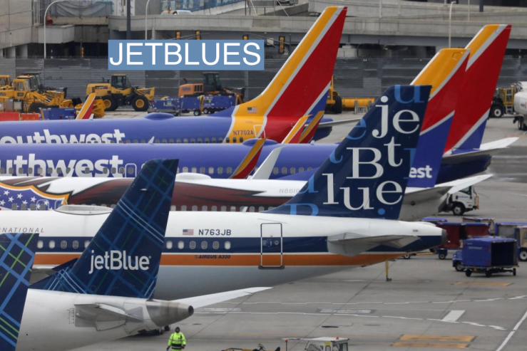 JetBlue and Southwest Airlines planes are parked at the LaGuardia Airport in New York City, U.S. March 4, 2023.
