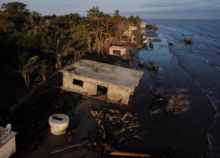 The remains of houses are pictured as rising sea levels are destroying homes built on the shoreline, forcing villagers to relocate, in El Bosque, Mexico