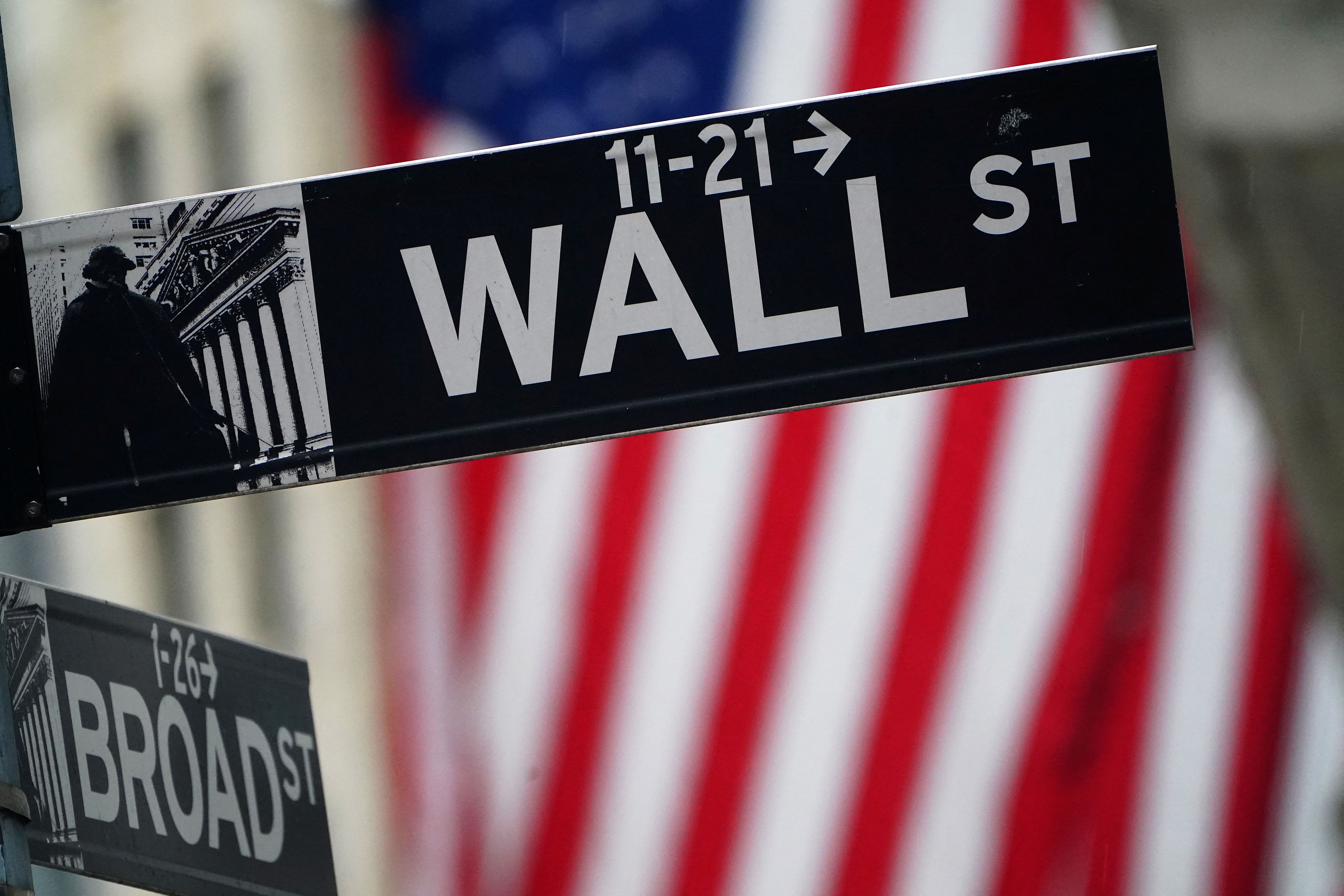 A Wall Street sign is pictured outside the New York Stock Exchange.
