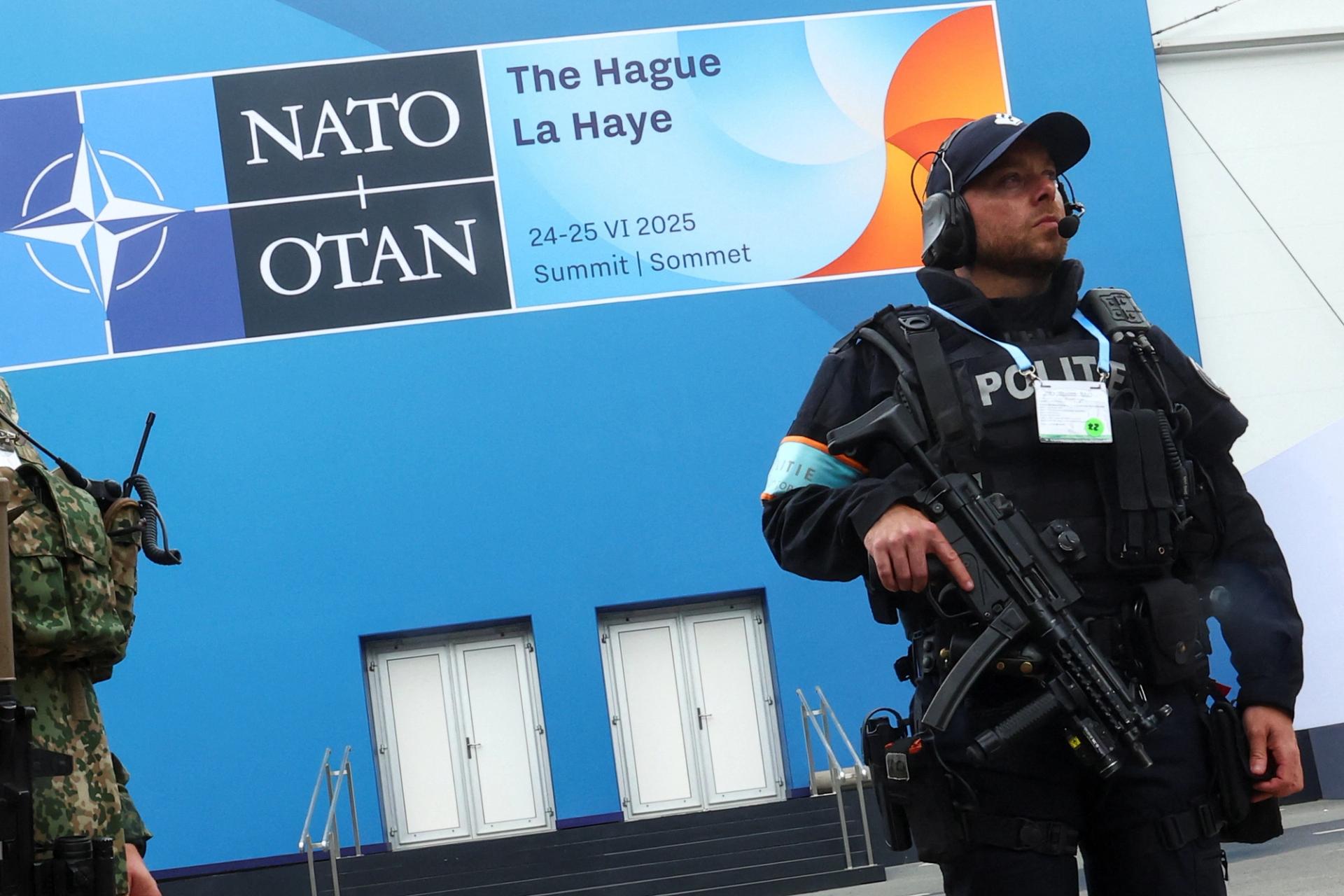 A member of Police guards the security perimeter ahead of a NATO leaders’ summit in The Hague.