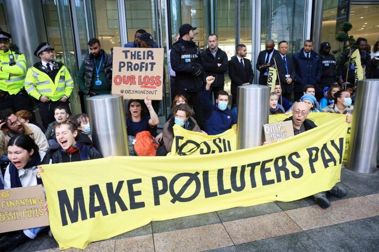 Demonstrators attend an ‘Oily Money Out’ protest against fossil fuel companies outside Barclays Bank, in London, Britain, October 19, 2023.