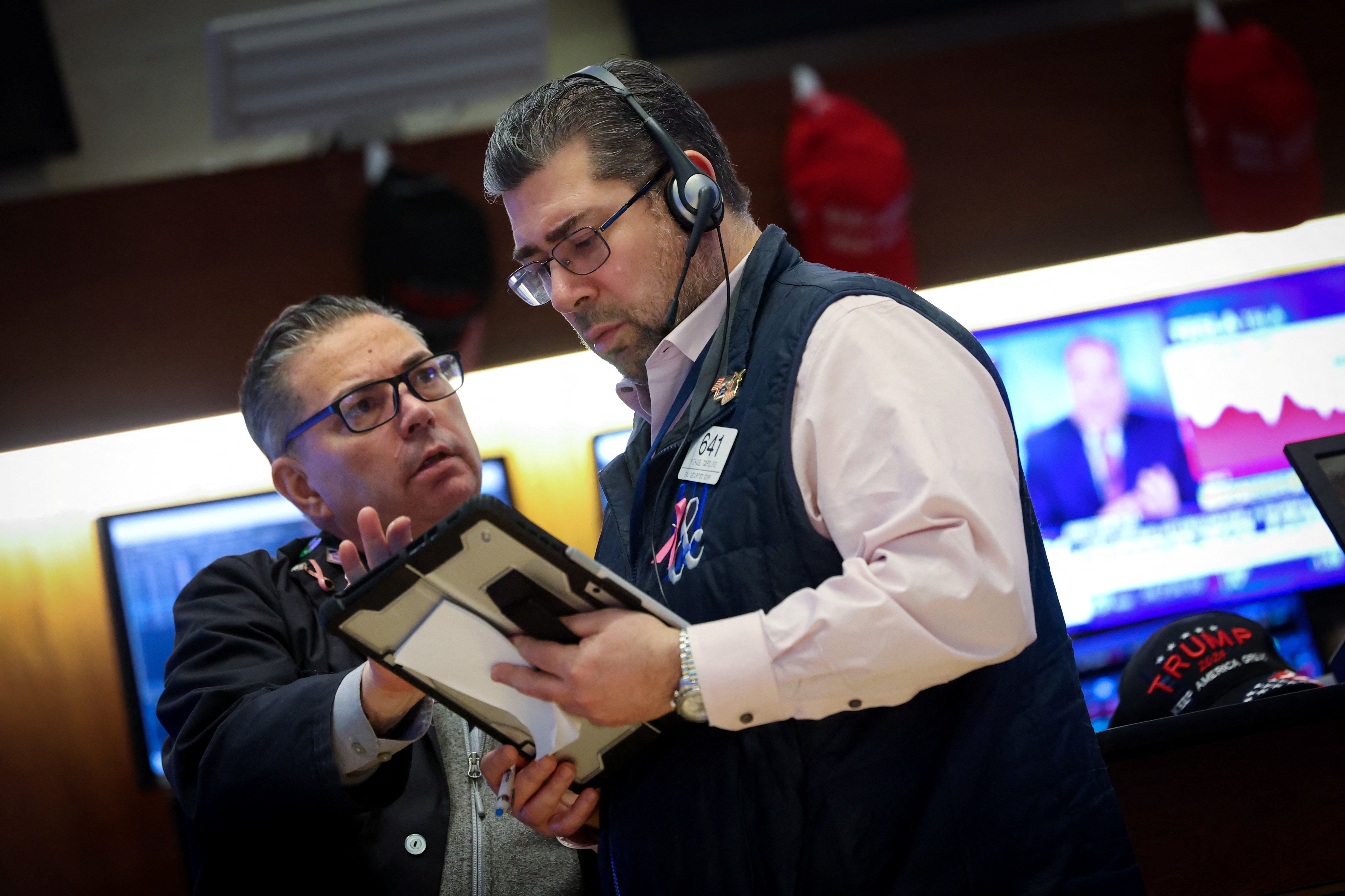 Traders work on the floor at the New York Stock Exchange.