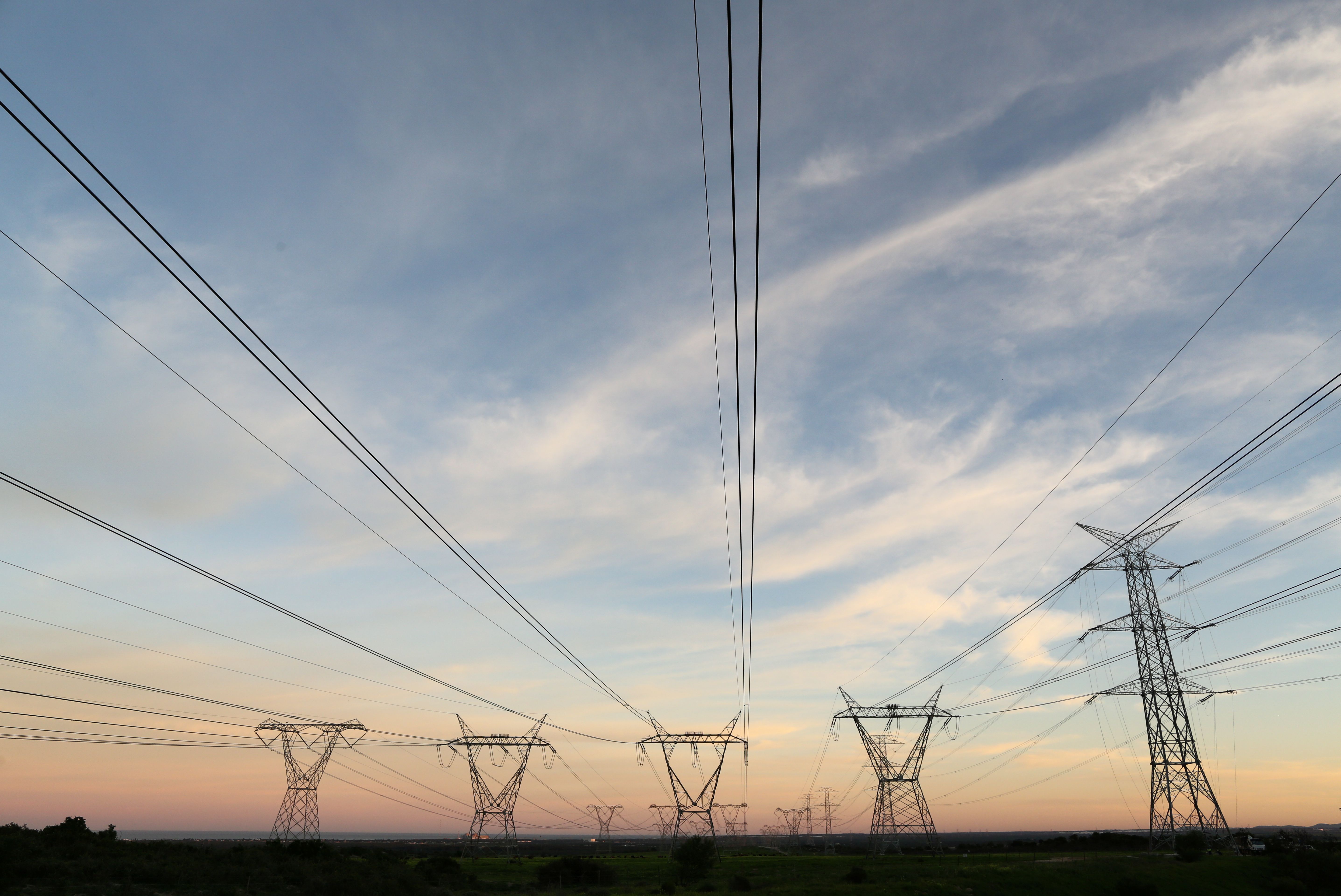 Electricity pylons carrying power from Koeberg nuclear power plant are seen in Cape Town.