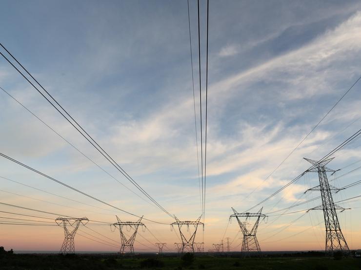 Electricity pylons carrying power from Koeberg nuclear power plant are seen in Cape Town.