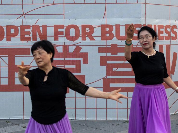 A sign reading open for business in Beijing.