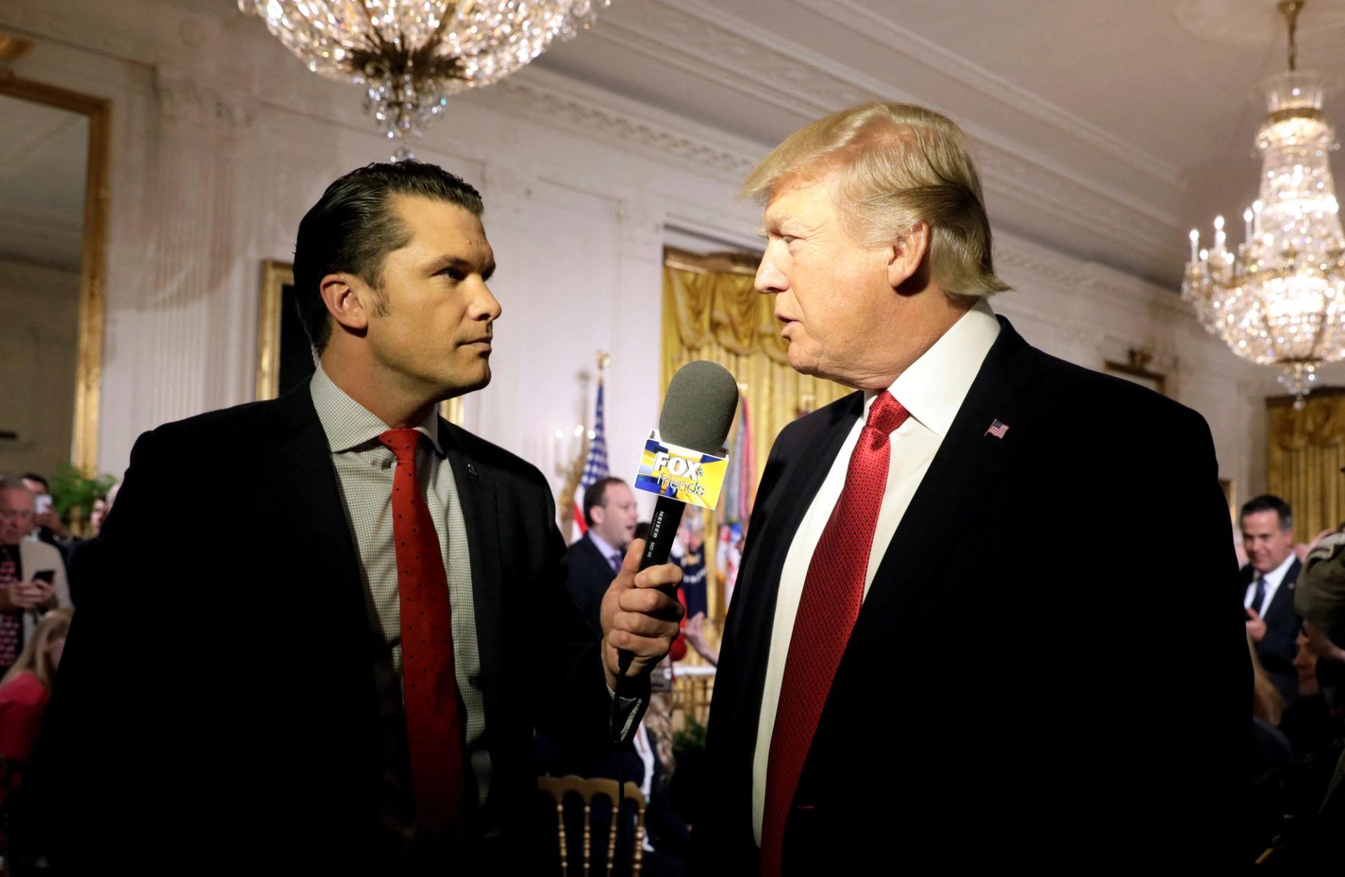 Donald Trump being interviewed by Fox and Friends co-host Pete Hegseth at the White House in 2017