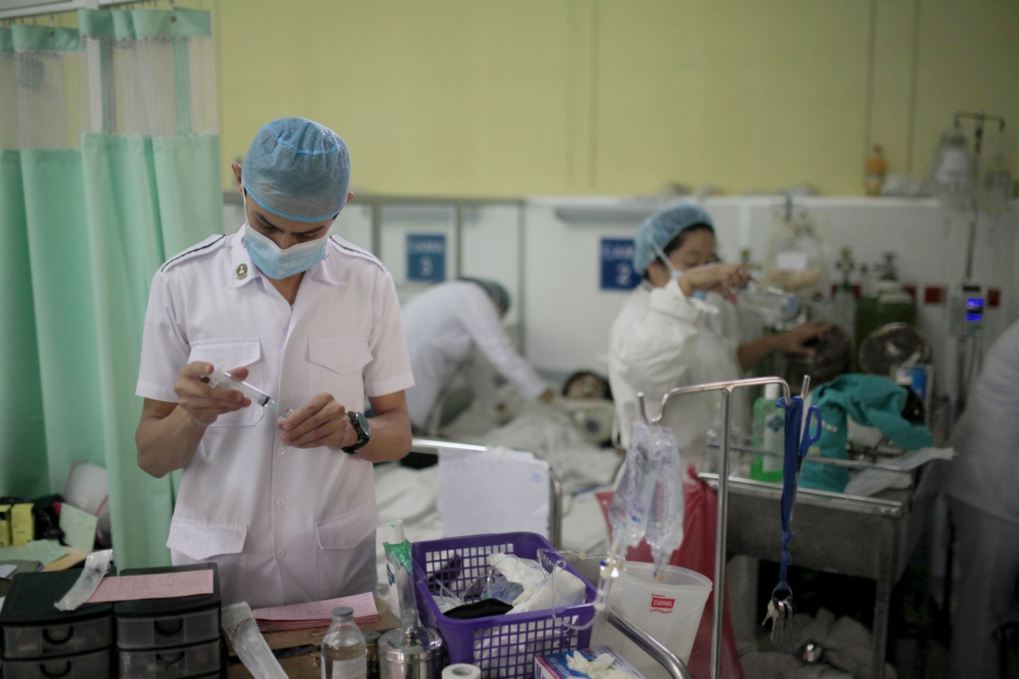 Nurses take care of Guillain-Barré syndrome patients in the neurology ward in a hospital in El Salvador. 